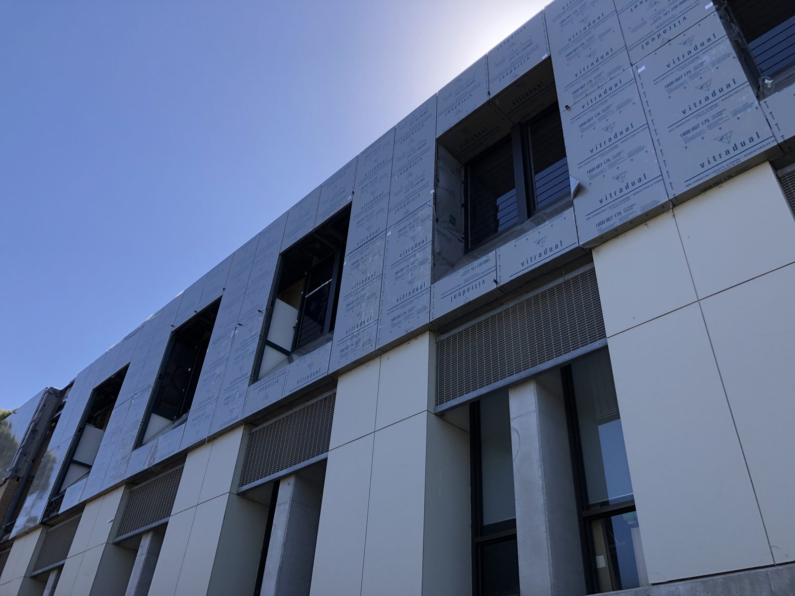 Wesley College — façade remediation and architectural cladding upgrade on a live campus